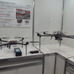 国土交通省の「次世代社会インフラ用ロボット開発・導入のための現場検証」で使われたドローンも展示（日立製作所）